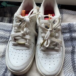 Nike White Sneakers with Gold Details